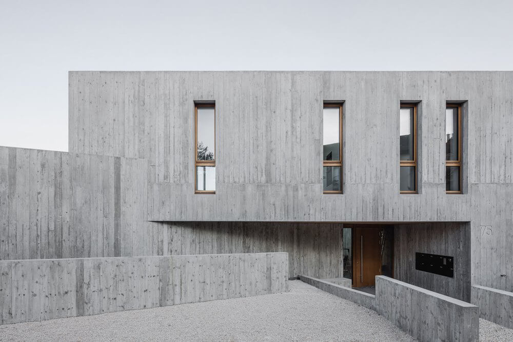 KohlerStraumann designs a concrete apartment building that seems monolithic and elegant at the